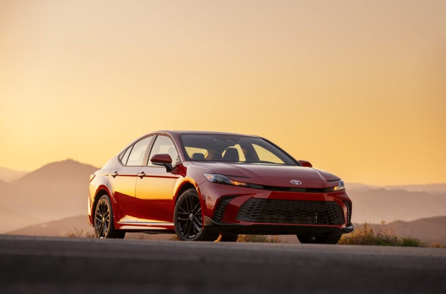 A red 2025 Toyota Camry parked in right front angle view during sunset