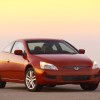 A red 2003 Honda Accord parked outside at dusk in right front angle view