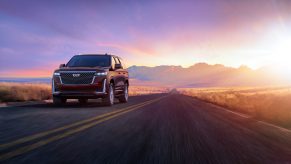 2024 Cadillac Escalade equipped with a GM L87 engine driving at sunset