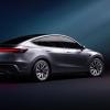 A silver Tesla Model Y shows off its refreshed look.