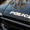 "Police" on the hood of a black car that Mason of Georgia rammed in Mississippi
