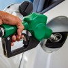 A person putting gas in their car