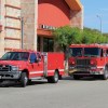 Two fire trucks near buildings