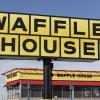 Waffle House exterior signage in close view with the restaurant building in the background