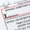 Closeup of the signature line on a speeding ticket.