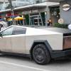 A Tesla Cybertruck on a city street, like the one dealing hot dogs.