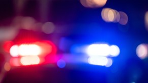 Police car with its lights on at night