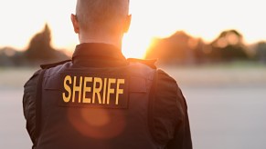 A sheriff looking at the horizon