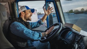 A angry semi-truck driver in traffic