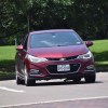 A red Chevy Cruze car in a parking lot